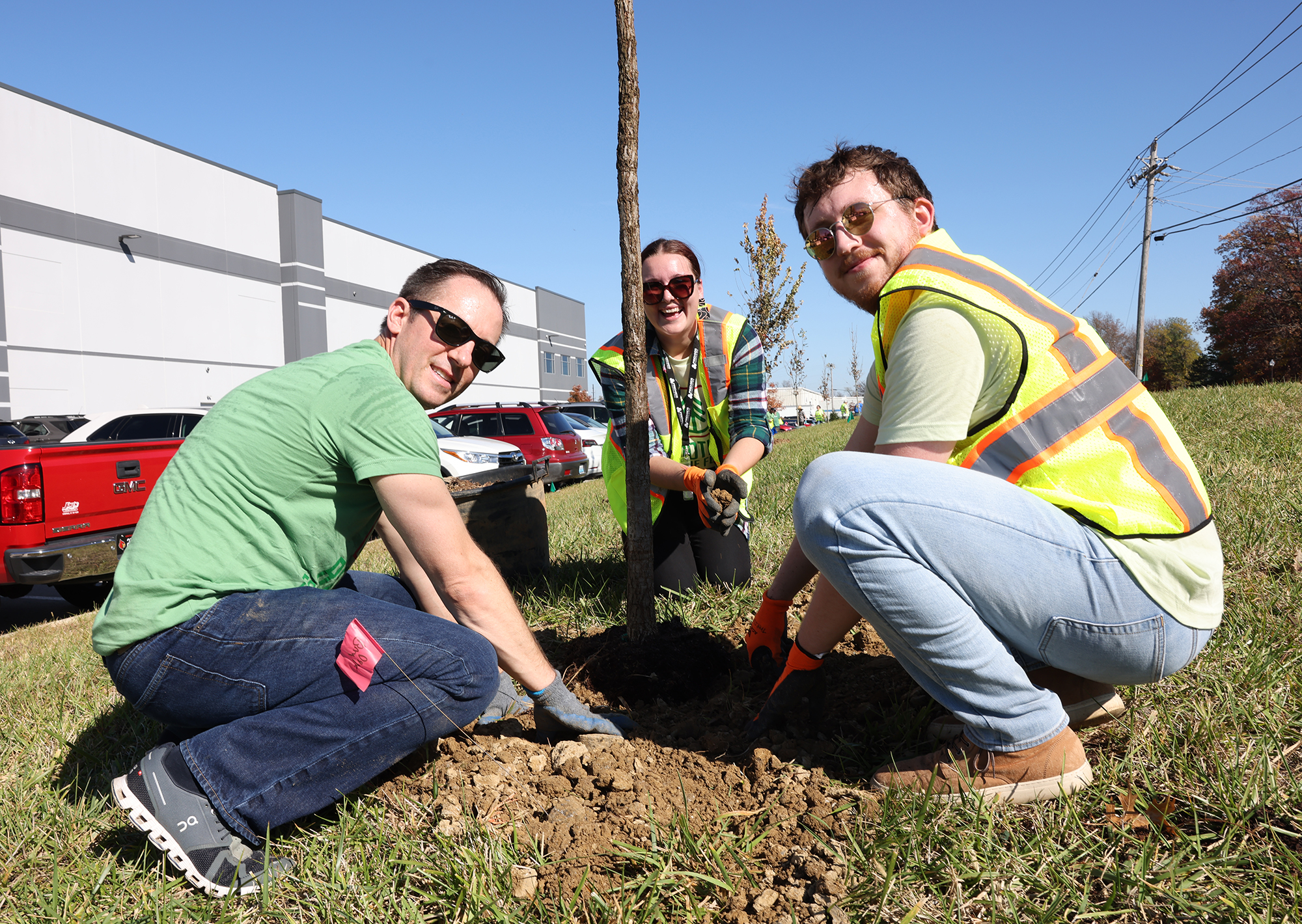 Premier Employees plant trees