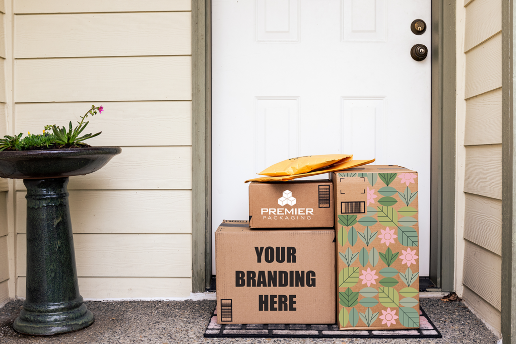 Branded packaging boxes on front porch; retail packaging boxes; ecommerce packaging