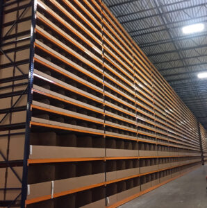 Large top to bottom view of bin boxes in racking inside a warehouse; packaging products; boxes for packaging products; premium packaging solutions