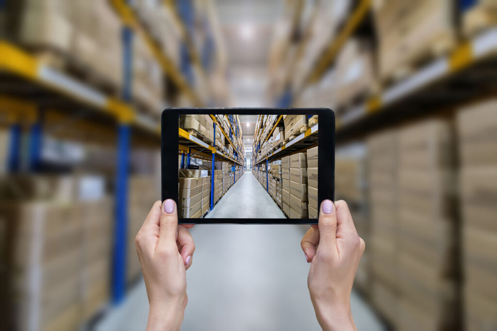Ordering online from a modern warehouse on a touchscreen tablet computer.