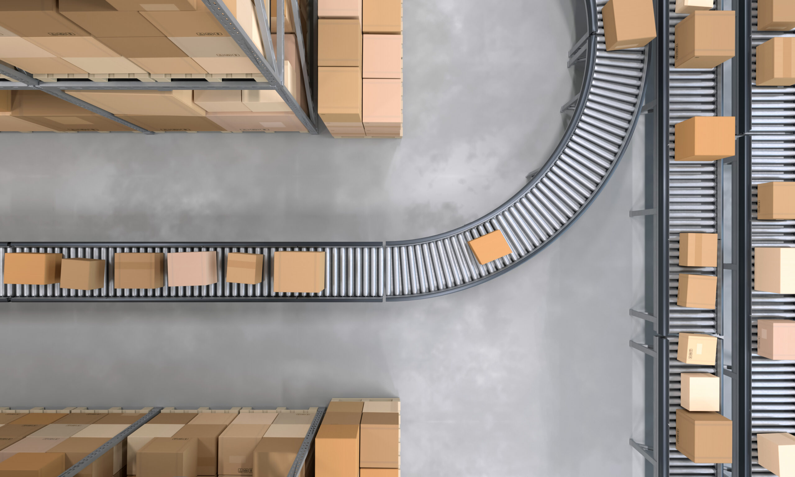 Top view of conveyor belts transporting boxes