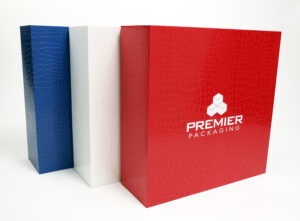 Red, White, and Blue luxury boxes with Premier Packaging logo