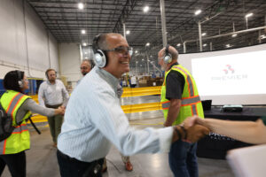 Premier warehouse manager shaking hands