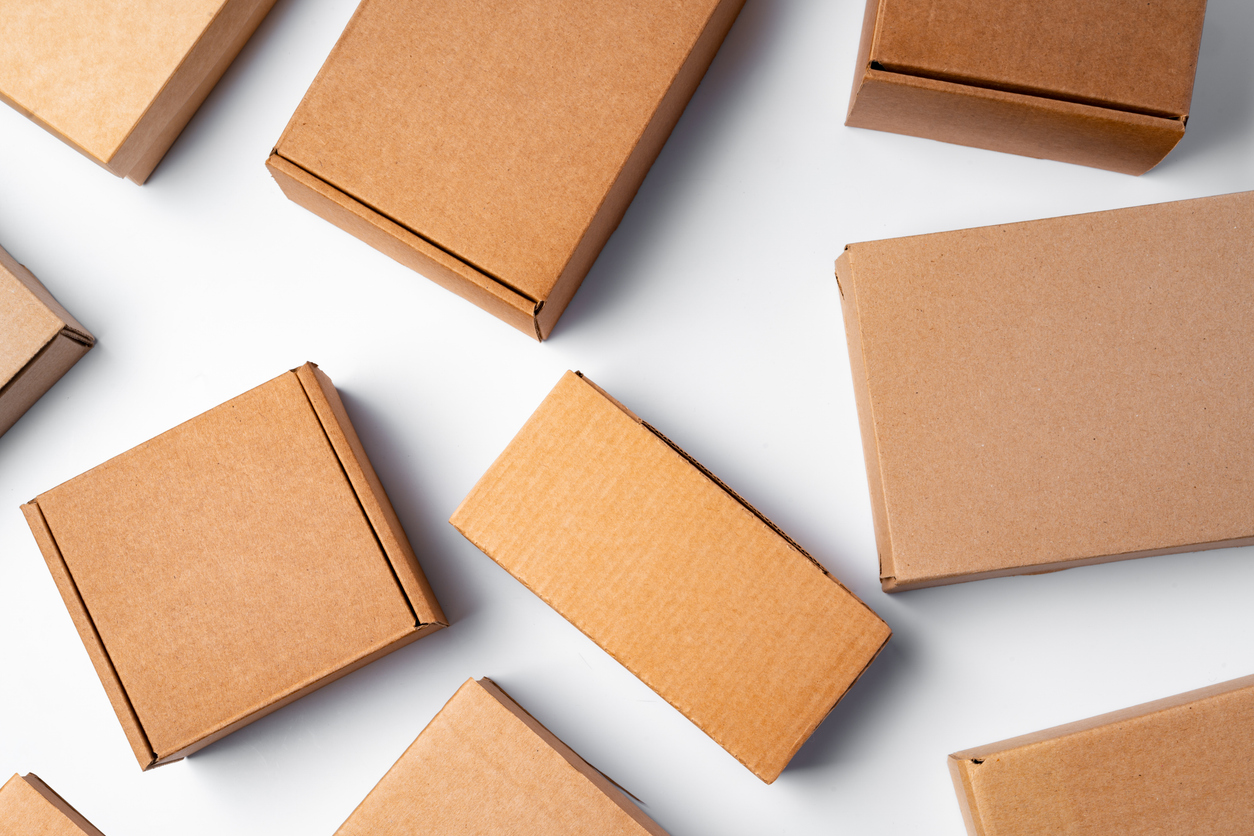 Multiple of corrugated boxes on white background, close up