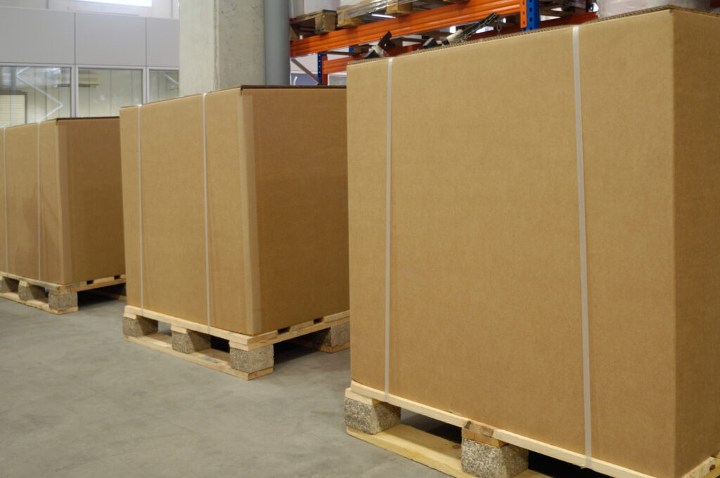 Large Gaylord Boxes lined up on warehouse floor