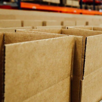 Erected corrugated cartons - close up on conveyor; packaging products; boxes for packaging products; premium packaging solutions