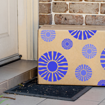 Custom printed corrugated box on front porch; boxes for packaging; ecommerce package; boxes for packaging; customized packaging box; packaging boxes; packaging industries; corrugated shipping boxes