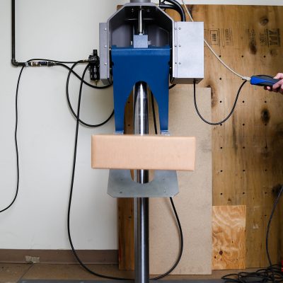 Package on Drop Tester Package being drop tested in Premier Packaging ISTA-certified lab; packaging for brands