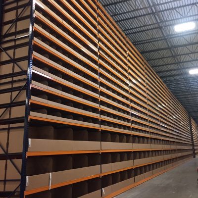 Large bin boxes in racking Large top to bottom view of bin boxes in racking inside a warehouse; packaging products; boxes for packaging products; premium packaging solutions