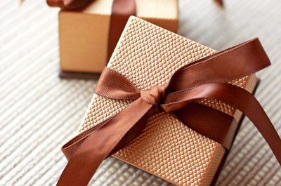 Brown boxes tied with ribbon; Luxury Packaging; luxury packaging boxes; luxury packaging companies